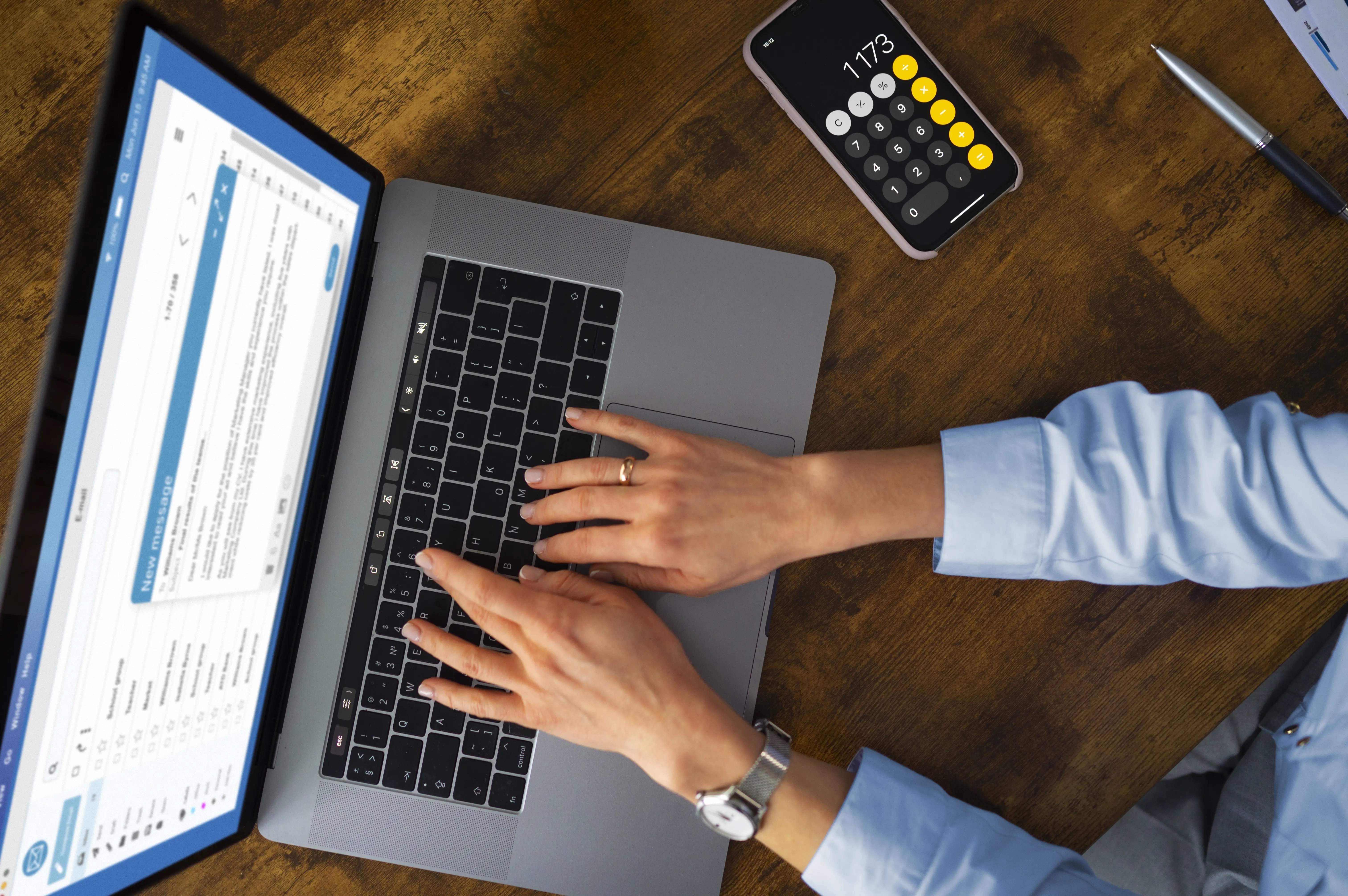 top-view-woman-typing-laptop
